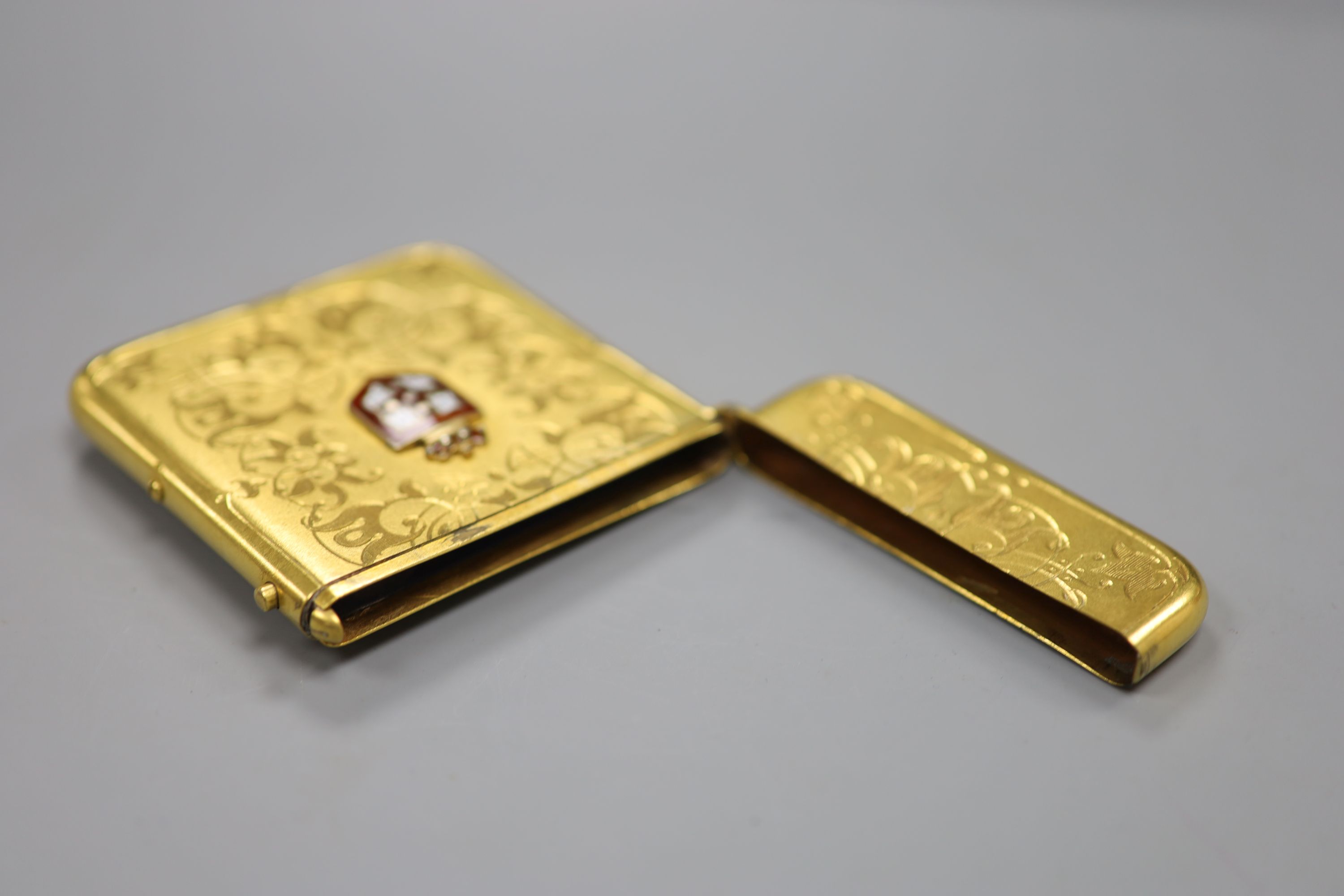 A gilt metal card case, with enamelled armorial badge, 10c,